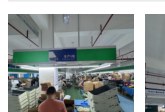 Finished-goods showroom with rows of hard-shell suitcases